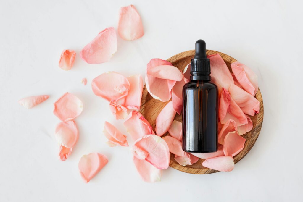 Photo by Photo By: Kaboompics.com: https://www.pexels.com/photo/composition-of-cosmetic-bottle-with-pink-rose-petals-and-wooden-plate-4041392/